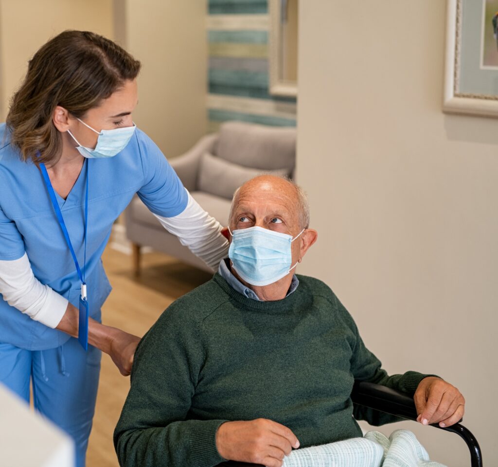 Picture of a carer and a man in a wheelchair
