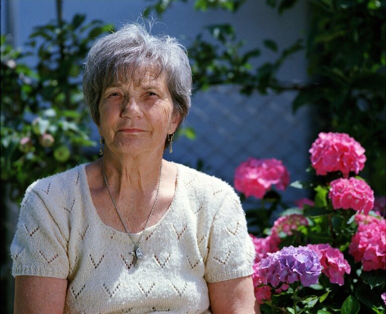 Woman next to roses