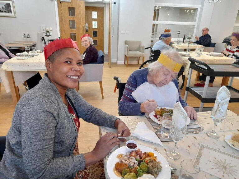 Carer and woman having dinnner